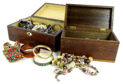 Two jewellery boxes and contents, to include clip on earrings, brooches, bangles, silver plated necklaces, modern jewellery etc. (a quantity).