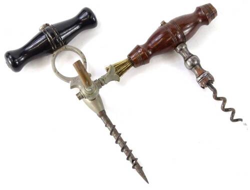 A 19thC hardwood and steel corkscrew with brush and a Holborn champagne screw with ebonised handle and tap. (2)