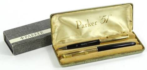 Two pen sets, comprising a Parker 51 set, in gilt and black with textured lids, comprising fountain pen with enclosed nib, 13cm W, and a pencil, etc.