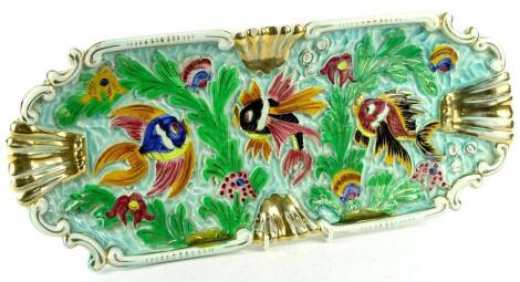 A Cadazer Monaco 1950s rectangular pottery tray or dish, decorated with exotic fish, leaves, etc., flanked by a pair of gilt carrying handles, 43cm W.