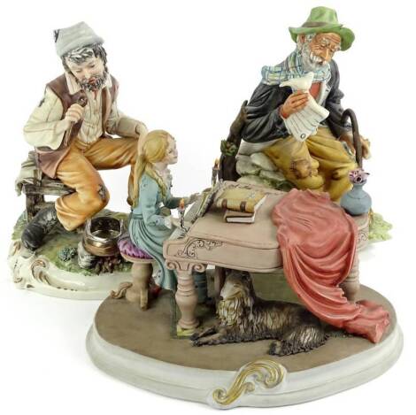 Various 20thC Capodimonte figures, to include figure playing piano 17cm H, tramp with dove on naturalistic base etc. (3)