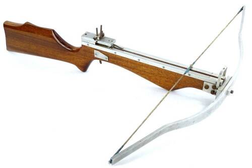 A mahogany and aluminum crossbow.