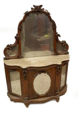 A Victorian figured walnut mirrorback chiffonier, with shaped plate and moulded frame, serpentine marble top, over fern and nut carved uprights, mirrored centre door and arched to the canted sides, shaped base and turned feet.