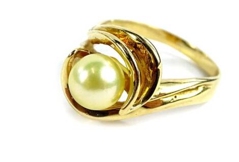 A cultured pearl dress ring, with single pearl in twist setting, yellow metal, marked 14K, ring size R, 5.7g all in.