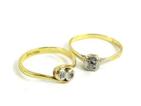 Two Victorian dress rings, to include an 18ct gold and platinum two stone diamond twist ring, ring size M½, 2.5g, and an 18ct gold single stone diamond ring, in square rub over setting, ring size N½, 2.1g. (2)