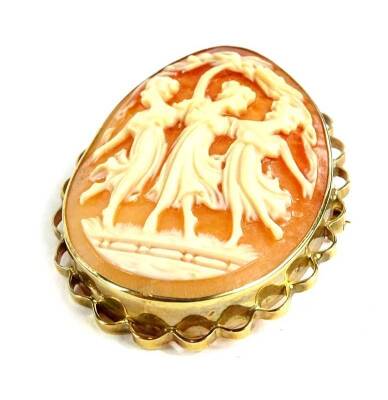 A 9ct gold framed shell cameo brooch, of three maidens in dance, with pierced fret border, 3cm x 4cm, 9.2g all in.