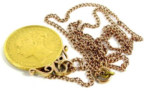 A Victorian full gold sovereign pendant and chain, dated 1883, with rose gold mount and fine link chain, yellow metal, unmarked, 12.7g all in.