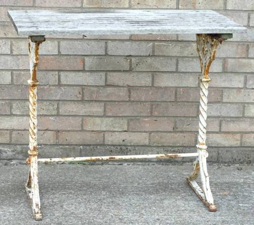 A Victorian cast iron table base, painted cream and, with a slatted top, 91cm W.