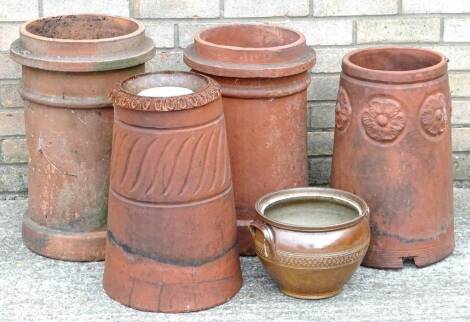 Two similar cylindrical terracotta chimney pots, two other chimney pots, a small cast iron urn etc. Provenance: The property of Joan Stephenson, Kirkwood, North Church Walk, Newark, Nottinghamshire.