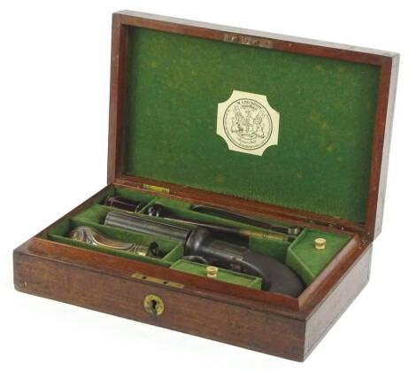 A mid 19thC pepperbox pistol, signed W.A. Beckwith of London, engraved with scrolls etc., finely incised mahogany handle and vacant oval cartouche, in fitted box, bearing makers paper label with some accessories etc., sold with original hand written lette