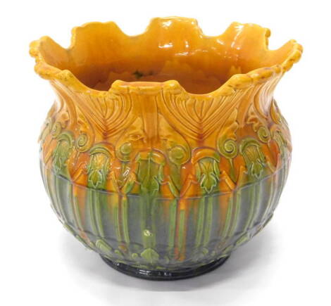 An early 20thC majolica glazed Art Nouveau pottery jardiniere, decorated with relief moulded bands in pressed mark to underside, don12 in, 37cm dia.