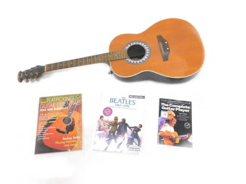 An Encore model Italian acoustic guitar, with guitar books, 105cm L.