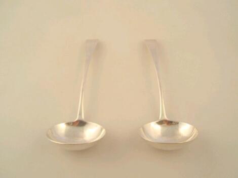 A pair of William IV silver old English pattern sauce ladles