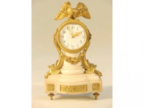 An early 20thC French gilt metal and alabaster mantel clock