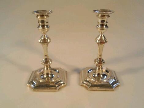 A pair of late Victorian silver candlesticks in the Georgian manner