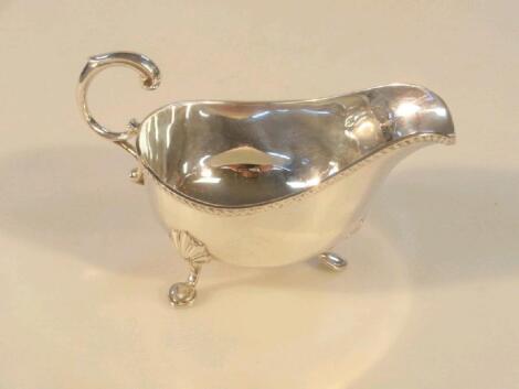 A small silver sauce boat of Georgian design with gadroon border and "C"