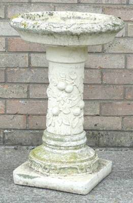 A composition bird bath, cast with flowers, fruits etc., on a square base, 67cm H, 48cm dia. - 2