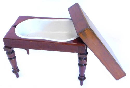 An early 19thC mahogany bidet, the loose cover enclosing a ceramic insert, on turned tapering legs, 61cm W. Provenance: The property of Joan Stephenson, Kirkwood, North Church Walk, Newark, Nottinghamshire.