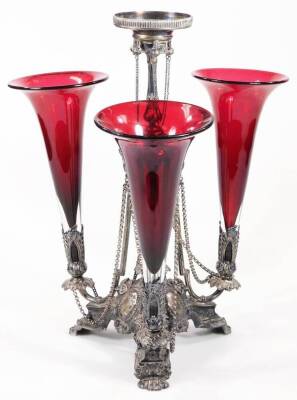 An Edwardian silver centrepiece, by Walker & Hall, the central bead and acanthus stem held on angular supports, the main body raised with scrolls and dots united by chains, with three leafy branches holding three cranberry coloured trumpets, on hairy paw - 2