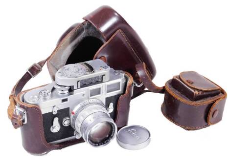 A Leica Ernst Leitz camera, with GMB H Wetzlar Summicron F=5cm 1:2 lens, a light meter brown leather case, 16cm W, and a further lens case. (a quantity)