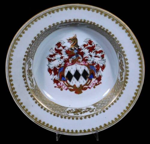 A Chinese export Armorial porcelain dish, the centre decorated with a large and important coat of arms within arrow and trellis gilt borders, 23cm Dia.