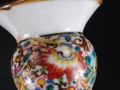 A Chinese porcelain guglet vase, decorated with oriental figures at various pursuits, below a floral decorated band and brown rim, 23cm H. - 7