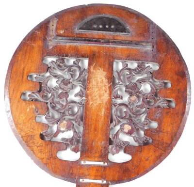 A Chinese soft wood face guard, of circular form, with partially pierced scroll centre and wooden handle, initialled, 49cm H. - 2