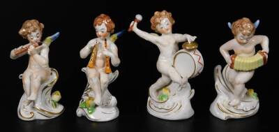 A Meissen style continental porcelain figure group, The Tailor's Wife Riding On A Goat, polychrome decorated predominately in pink, blue and green, 21cm H, four Capodimonte figures of cherub bandsman, and two 20thC vases, with gilt highlights, decorated w - 9