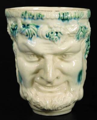 A late 18thC English creamware Bacchus satyr mug, typically decorated in green splash colours, on a circular foot, 11cm H. - 2