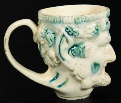 A late 18thC English creamware Bacchus satyr mug, typically decorated in green splash colours, on a circular foot, 11cm H. - 3