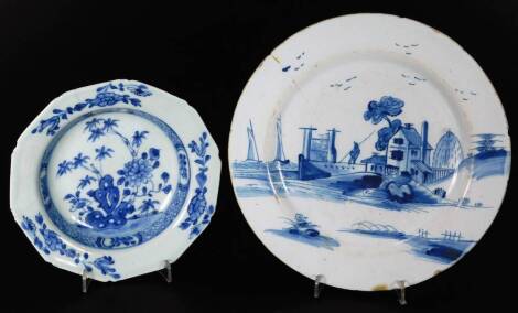 An 18thC Dutch Delft blue and white plate, of circular form, decorated with a scene of figure before buildings and boats, on a circular foot, no.2 beneath, 22cm Dia. and a further Japanese porcelain dish of octagonal form. (2)