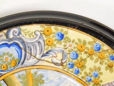 A pair of Italian Maiolica wall plaques, each of circular form, the first centred with figures and cattle, the second a classical scene with further figures with scroll borders broken by flowers and cherubs, predominately in green, orange and blue, unmar - 8