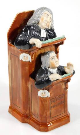 A Staffordshire pottery Vicar and Moses group, after the Wood family original, incised R.Wood 1794, and inscribed The Vicar and Moses the group with preacher and vicar, 23cm H.