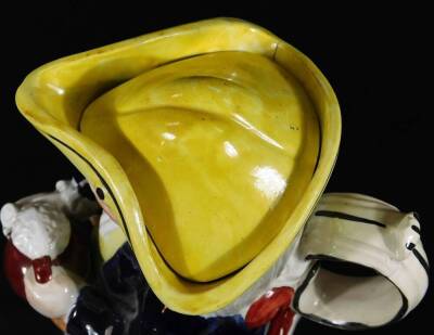 A mid 19thC Staffordshire pottery Toby jug and cover, decorated with a bright yellow triangular hat and cover. 25cm H. - 6