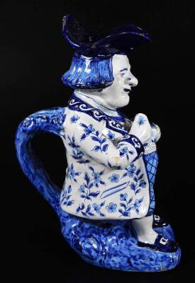 A Dutch Delft model of a snuff taking Toby jug, decorated in blue and white. 28cm H. - 5