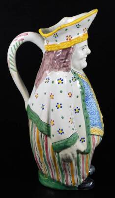 A French faience Toby jug decorated in bright colours, c.1900. 28cm H. - 2