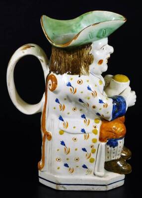 An early 19thC Prattware Toby jug, the toper sat in floral jacket picked out in yellow, holding a jug, aside pipe, with green hat, orange breeches and brown shoes, 24cm H. - 5