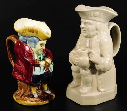 A small Majolica glazed Toby jug, with crimson coat, c.1900. 19cm H, together with a Pearson's of Chesterfield Toby jug, impressed mark for Oldfield, 22cm H.