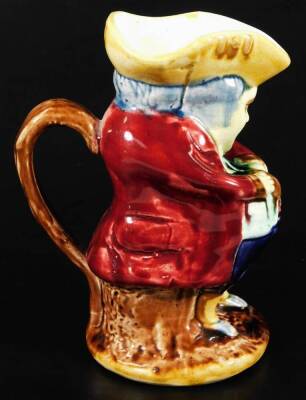 A small Majolica glazed Toby jug, with crimson coat, c.1900. 19cm H, together with a Pearson's of Chesterfield Toby jug, impressed mark for Oldfield, 22cm H. - 3