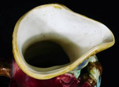 A small Majolica glazed Toby jug, with crimson coat, c.1900. 19cm H, together with a Pearson's of Chesterfield Toby jug, impressed mark for Oldfield, 22cm H. - 4