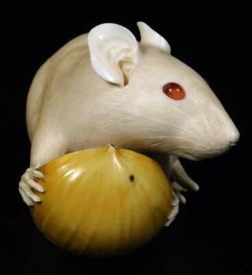 A fine late Meiji period ivory figure of a rat holding a nut, three character red seal mark, the rat with semi precious stone eyes, 14cm L. - 2