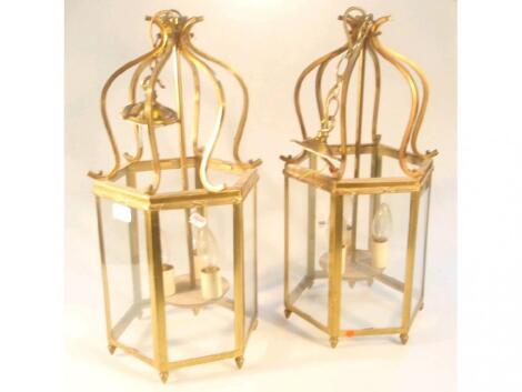 A pair of Victorian style gilt brass hall lanterns