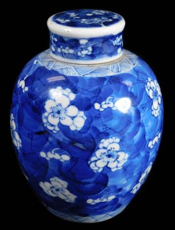 A 19thC Chinese Qing porcelain prunus vase, of bulbous form, with shaped lid and upper geometric banding, four character mark beneath, 15cm H.