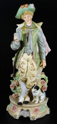 A continental bisque porcelain figure of a gentleman, in standing pose aside dog, he holding cup aside wall, on a floral lined base, predominately in pink, green and fawn with gilt highlights, no. 5816 25, 40cm H.