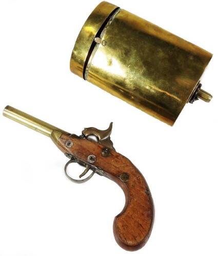 A 19thC brass and walnut pocket pistol, 19cm W and an eastern brass combination shot and powder flask of oval form. (2)