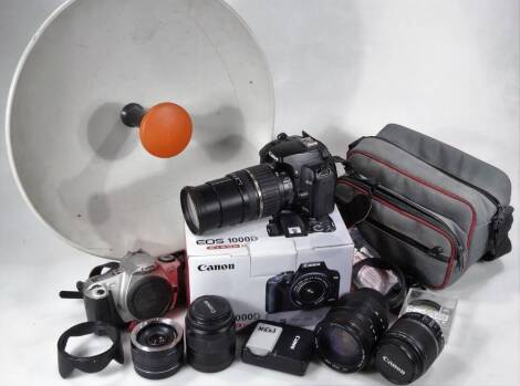 Various cameras and accessories, Canon and other lenses, to include Sigma 28-200mm, Zoom lens 18-55mm, various other Canon, E0S300 camera, 15cm W, a Zehnder Multima portable satellite dish, various other Canon and other cameras, etc. (a quantity)