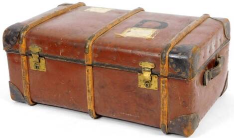 An early 20thC Orint brown leather steamer trunk, with part wooden banding studded spandrels with side carrying handles and a plain interior, 34cm H, 83cm W, 56cm D.