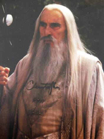 A Lord Of The Rings related photographic print, signed Christopher Lee, mounted and framed, 31cm x 25cm.