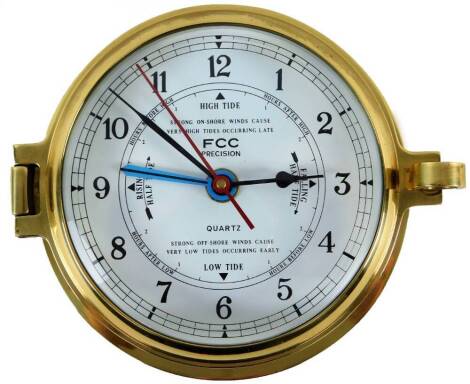 A 20thC FCC quartz ship's bulk head style clock, with 11.5cm Arabic dial, in a plain brass case.