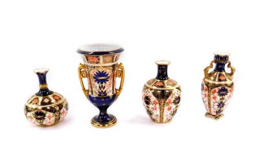 Four Royal Crown Derby imari porcelain vases, printed and painted marks, comprising a campana vase, 14cm H, twin handled baluster vase, 12cm H, and two further vases, 9.5cm H and 10cm H.